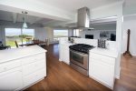 The kitchen includes high end appliances and a gas stove.